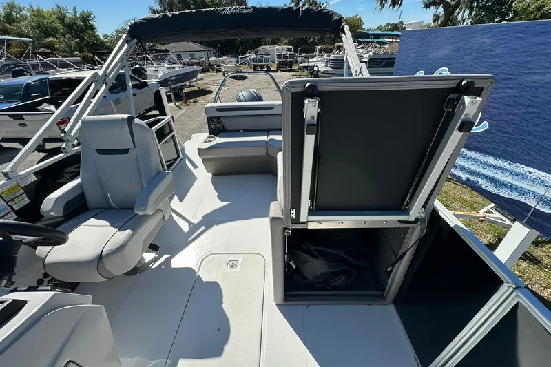 Slide: The Image of 2026 Sweetwater FD2260RE3 boat interior with seating and storage compartments. - 11