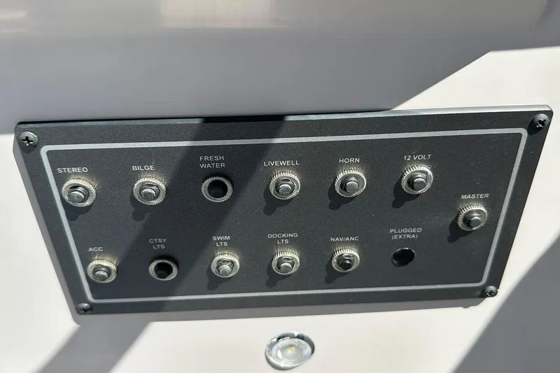 Slide: The Image of Control panel of Sweetwater FD2260RE3 boat, featuring various switches and functions. - 18