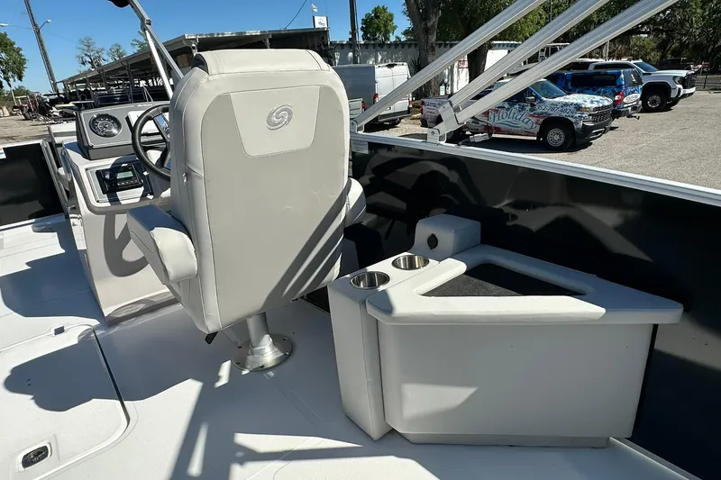 Slide: The Image of Interior of 2026 Sweetwater FD2260RE3 boat with captain's chair and console. - 19