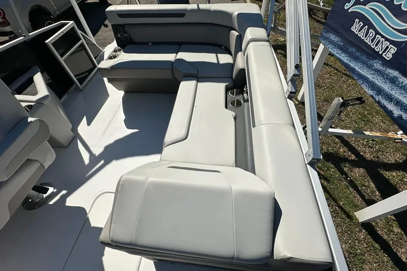 Slide: The Image of Spacious seating on 2026 Sweetwater FD2260RE3 boat, featuring modern design and cup holders. - 20