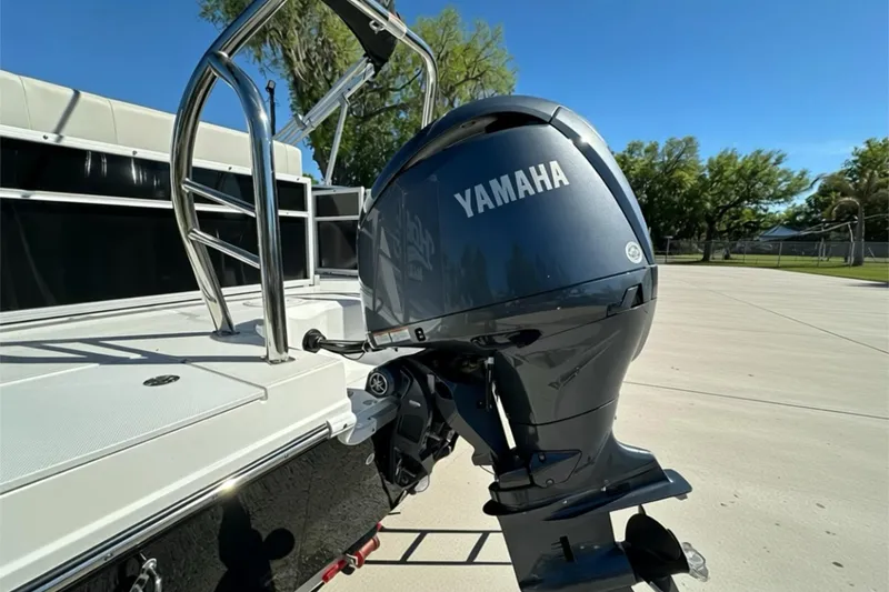 Slide: The Image of 2026 Sweetwater FD2260RE3 boat with Yamaha outboard motor in sunny outdoor setting. - 28