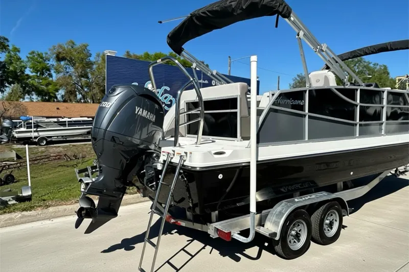 Slide: The Image of 2026 Sweetwater FD2260RE3 pontoon boat with Yamaha engine on trailer. - 29