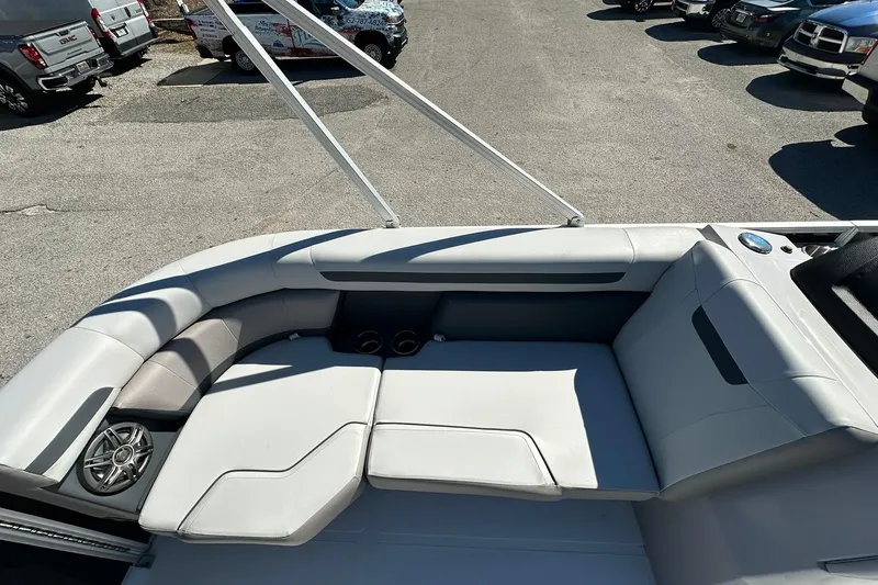 Slide: The Image of 2026 Sweetwater FD2260RE3 boat interior with gray seating and speaker. - 8