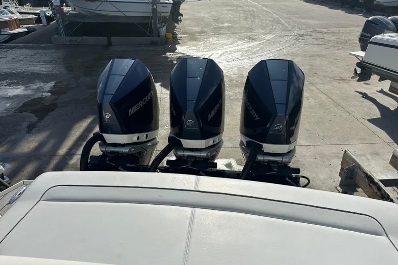 Slide: The Image of Triple Mercury outboard engines on a 2021 Formula 330 Crossover Bowrider OB boat. - 10