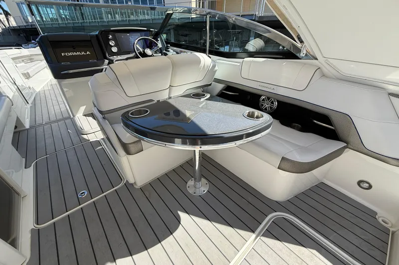 Slide: The Image of 2021 Formula 330 Crossover Bowrider OB interior with sleek seating and modern dashboard. - 18