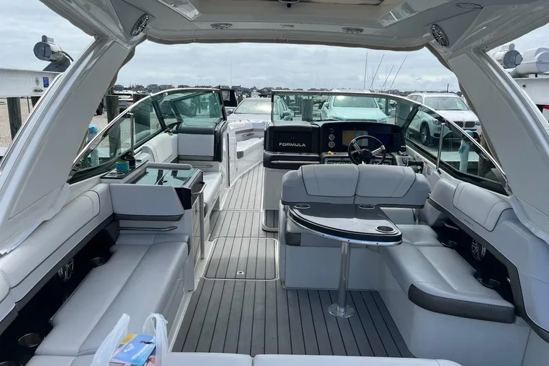 Slide: The Image of 2021 Formula 330 Crossover Bowrider OB interior with luxurious seating and modern dashboard. - 21