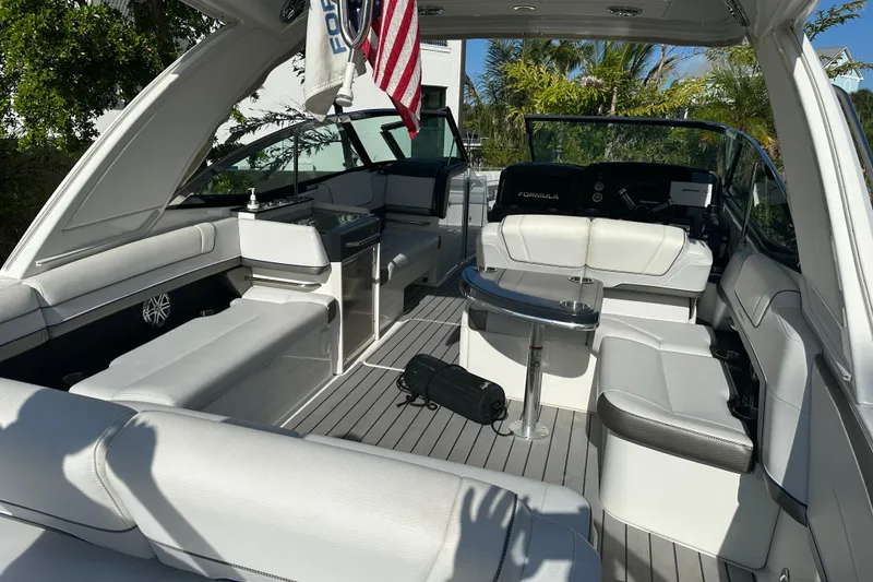 Slide: The Image of 2021 Formula 330 Crossover Bowrider OB interior with luxurious seating and modern amenities. - 24