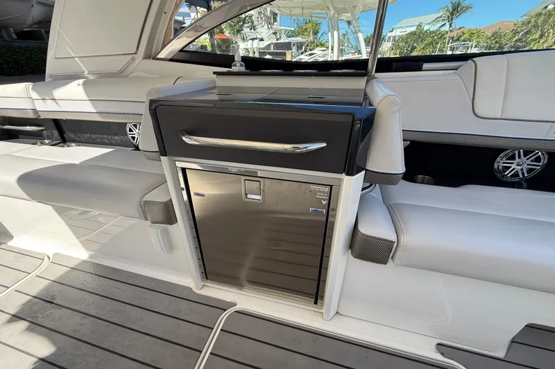 Slide: The Image of Interior of 2021 Formula 330 Crossover Bowrider OB with seating and built-in cooler. - 26