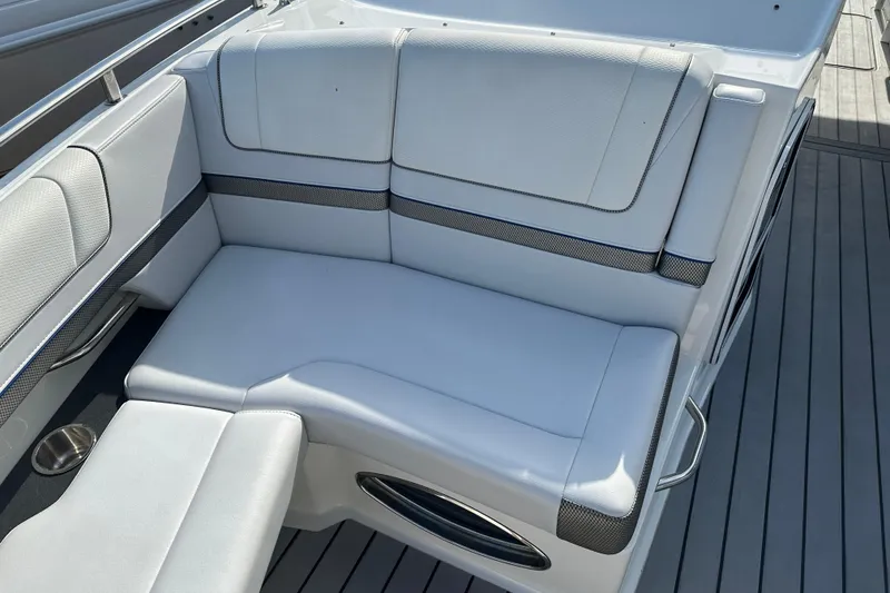 Slide: The Image of 2021 Formula 330 Crossover Bowrider OB, white seating area with sleek design. - 28