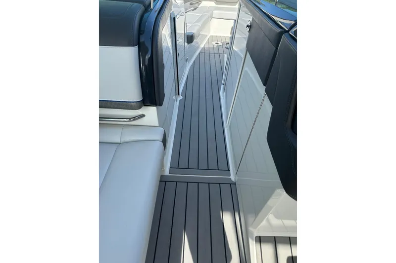 Slide: The Image of 2021 Formula 330 Crossover Bowrider OB interior with sleek seating and modern flooring. - 32