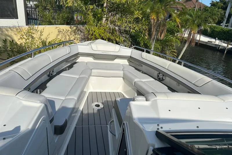 Slide: The Image of 2021 Formula 330 Crossover Bowrider OB with spacious seating and sleek design. - 34