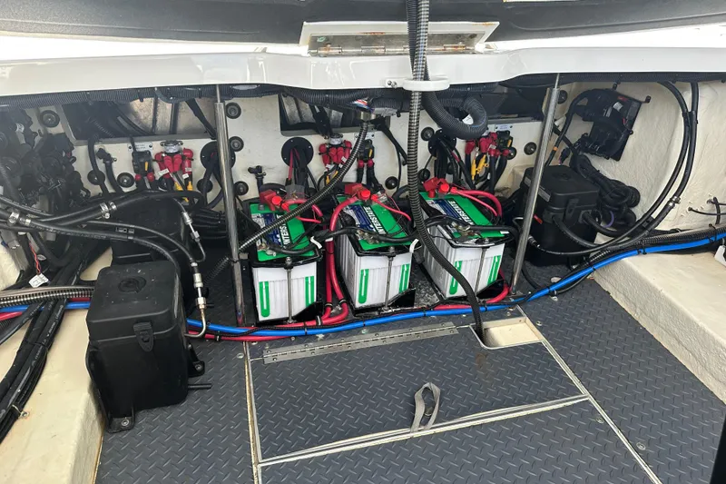 Slide: The Image of Engine compartment of a 2021 Formula 330 Crossover Bowrider OB with batteries and wiring. - 40