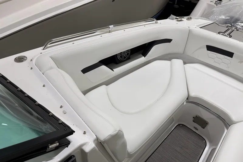 Slide: The Image of 2024 Four Winns HD5 boat interior with white seating and modern design. - 11
