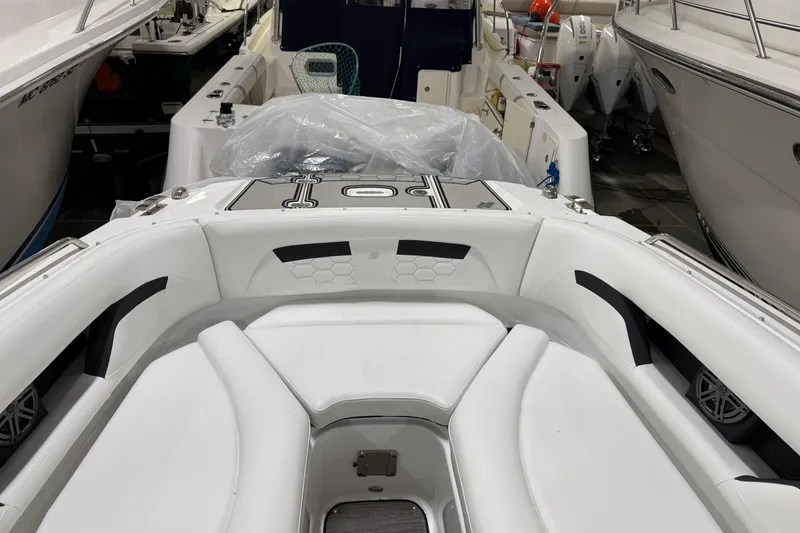 Slide: The Image of 2024 Four Winns HD5 boat interior with white seating and modern design. - 12