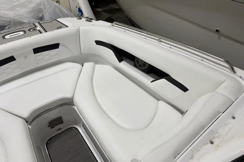 Slide: The Image of 2024 Four Winns HD5 boat interior with white seating and sleek design. - 13