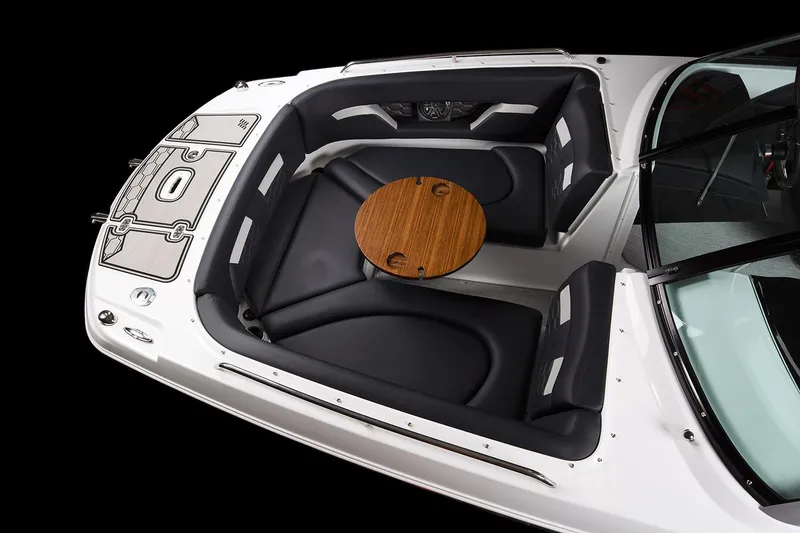 Slide: The Image of Manufacturer Provided Image: 2024 Four Winns HD5 boat interior with round wooden table and black seating. - 28