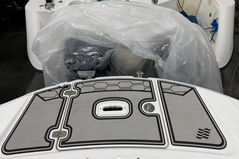 Slide: The Image of 2024 Four Winns HD5 boat deck with protective cover and modern design elements. - 37