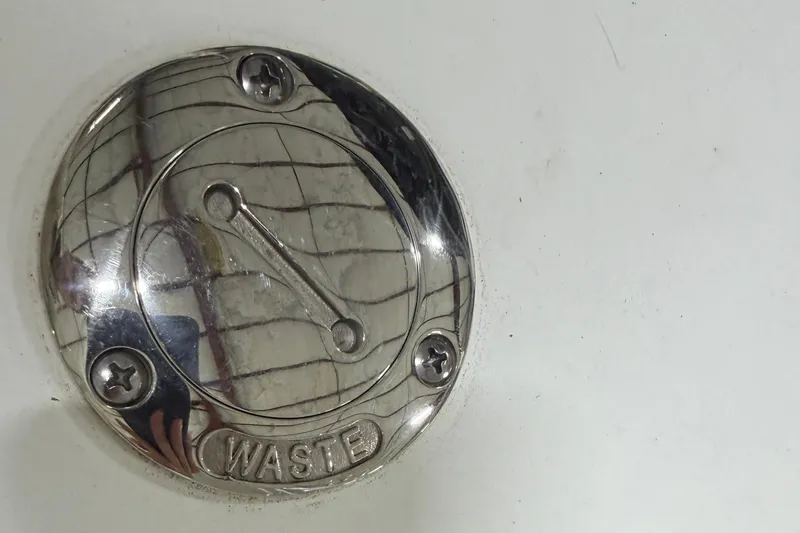 Slide: The Image of 2024 Four Winns HD5 waste cap on boat deck, close-up view. - 42