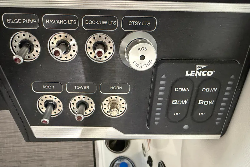 Slide: The Image of Control panel of 2024 Four Winns HD5 boat with switches and Lenco trim tabs. - 51