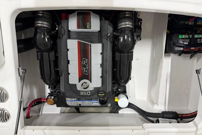 Slide: The Image of 2024 Four Winns HD5 boat engine compartment featuring a powerful 6.2L 350 horsepower engine. - 53