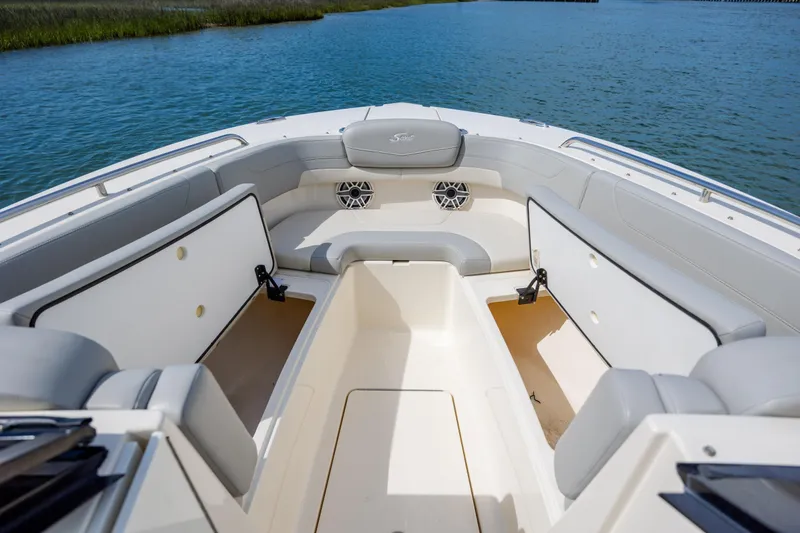 Slide: The Image of 2023 Scout 277 Dorado boat interior with seating and storage compartments. - 31