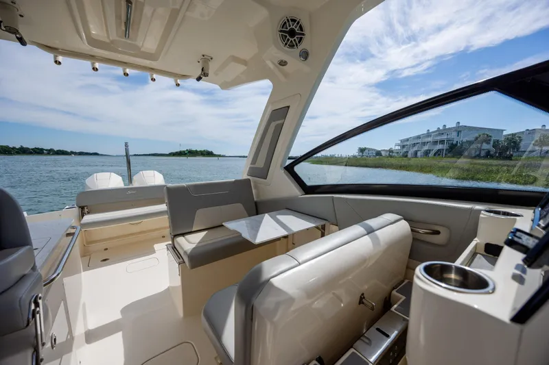 Slide: The Image of Interior view of 2023 Scout 277 Dorado boat with seating and water view. - 32