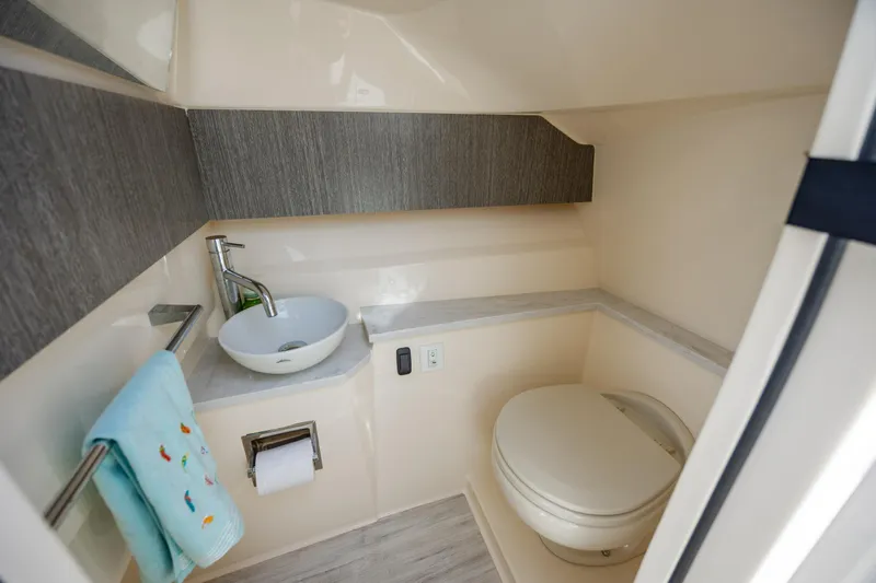 Slide: The Image of 2023 Scout 277 Dorado boat bathroom with modern sink and toilet. - 33