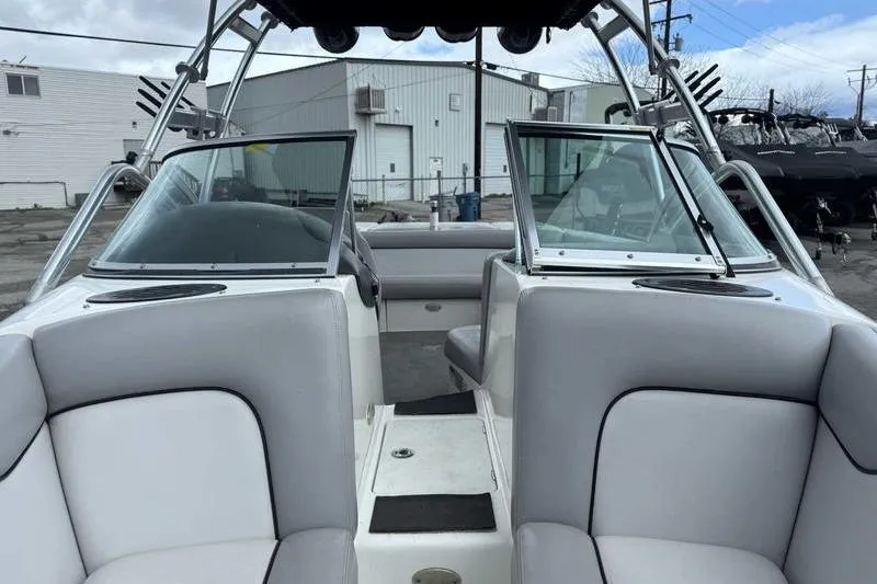 Slide: The Image of 2005 Centurion Elite V-Drive boat interior with open windshield and gray seating. - 13