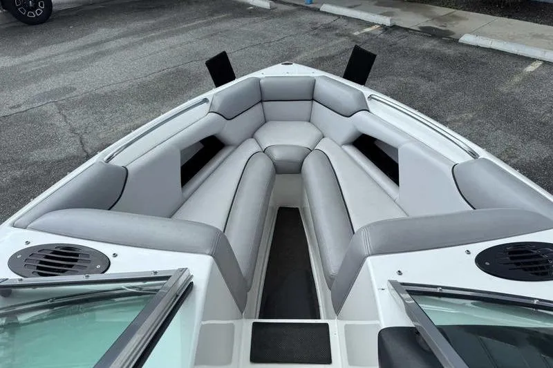 Slide: The Image of 2005 Centurion Elite V-Drive boat interior with gray seating and speakers. - 14