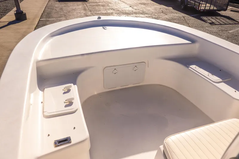 Slide: The Image of Bow area of 2022 Savannah SS21 boat, featuring storage compartments and seating. - 15