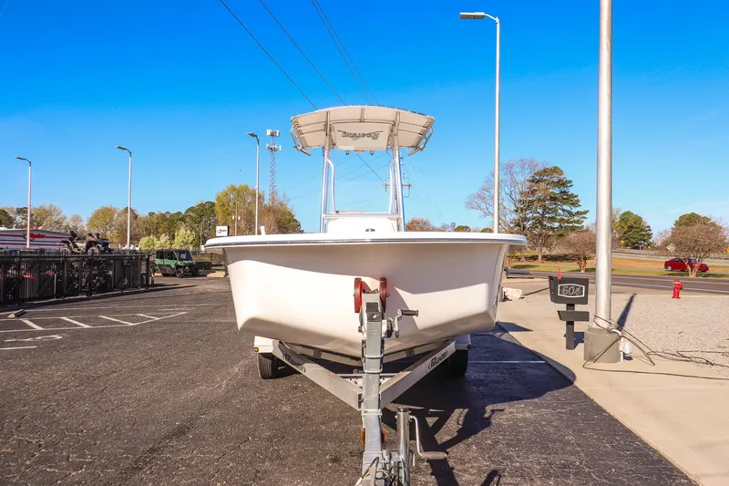 Slide: The Image of 2022 Savannah SS21 boat on trailer in parking lot under clear blue sky. - 7