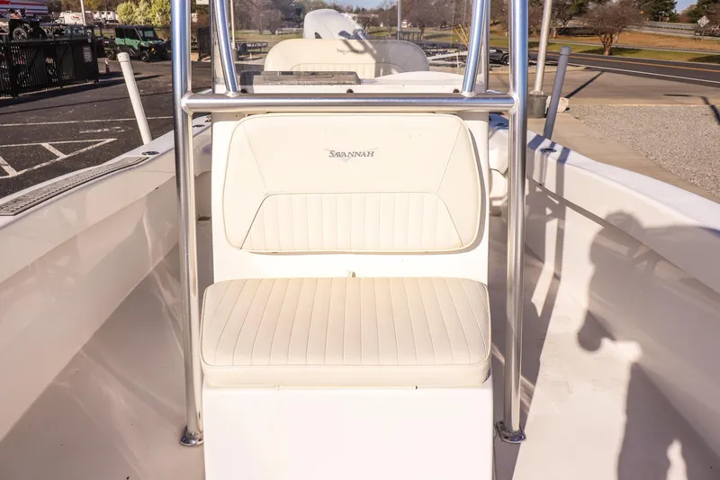 Slide: The Image of 2022 Savannah SS21 boat interior with white seating and chrome details. - 9