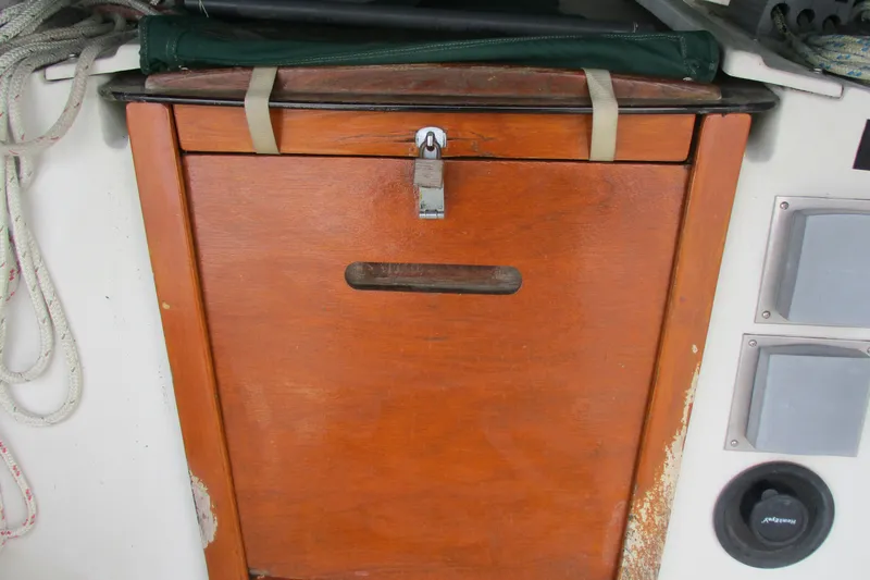 Slide: The Image of Wooden hatch door on a 1981 C & C 32 sailboat with lock and ropes. - 15