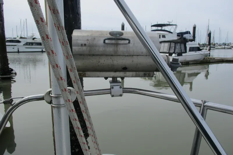 Slide: The Image of Sailboat deck with mounted grill, marina background, C & C 32, 1981 model. - 17