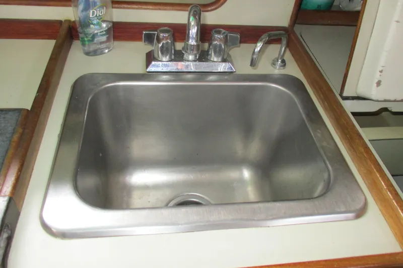 Slide: The Image of Stainless steel sink in 1981 C & C 32 yacht kitchen area. - 19