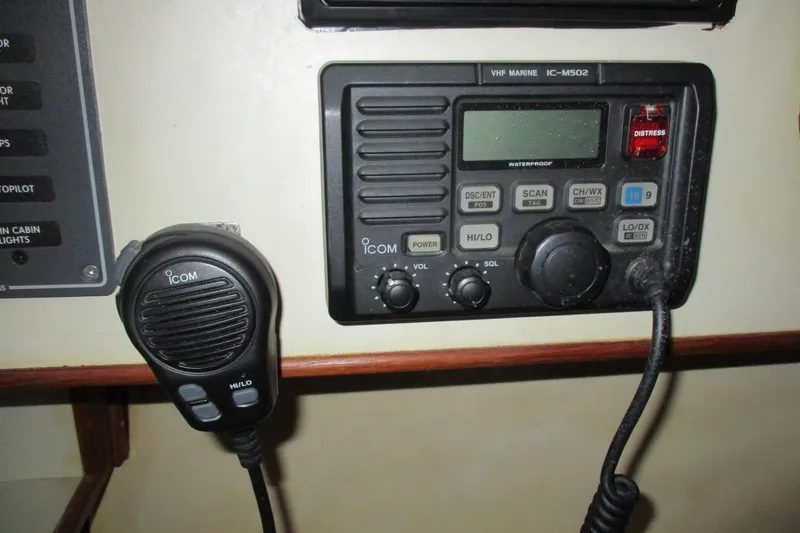 Slide: The Image of VHF marine radio on 1981 C & C 32 sailboat, featuring Icom IC-M502 model. - 28