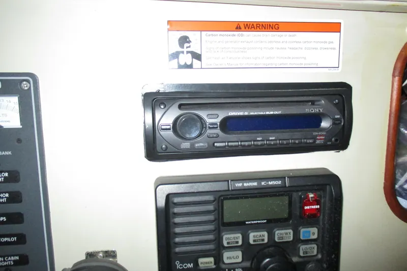 Slide: The Image of 1981 C & C 32 boat interior with Sony stereo and VHF marine radio. - 29