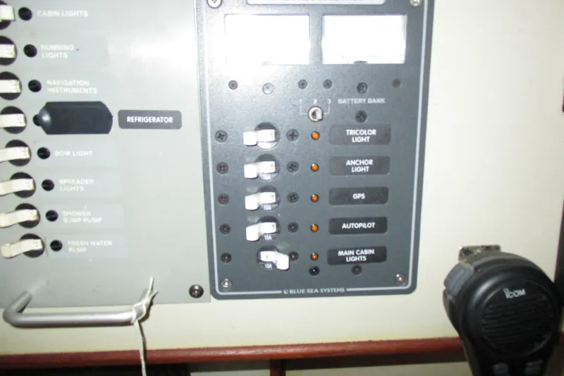 Slide: The Image of Electrical control panel on a 1981 C & C 32 sailboat, featuring various switches and labels. - 30