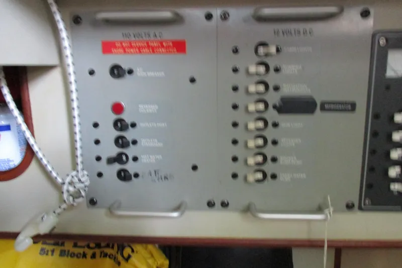 Slide: The Image of Electrical panel on a 1981 C & C 32 sailboat, featuring switches and controls. - 31