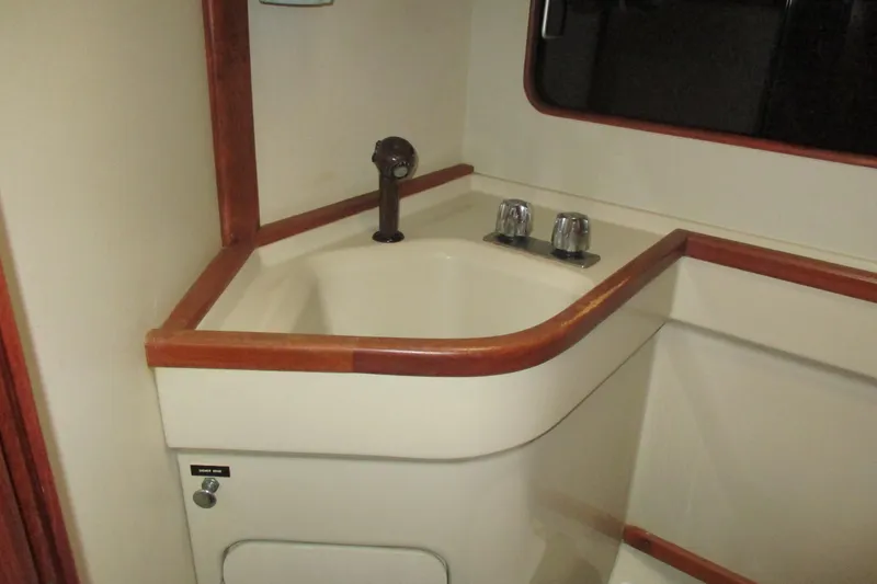 Slide: The Image of Interior sink area of 1981 C & C 32 sailboat with wooden trim. - 35