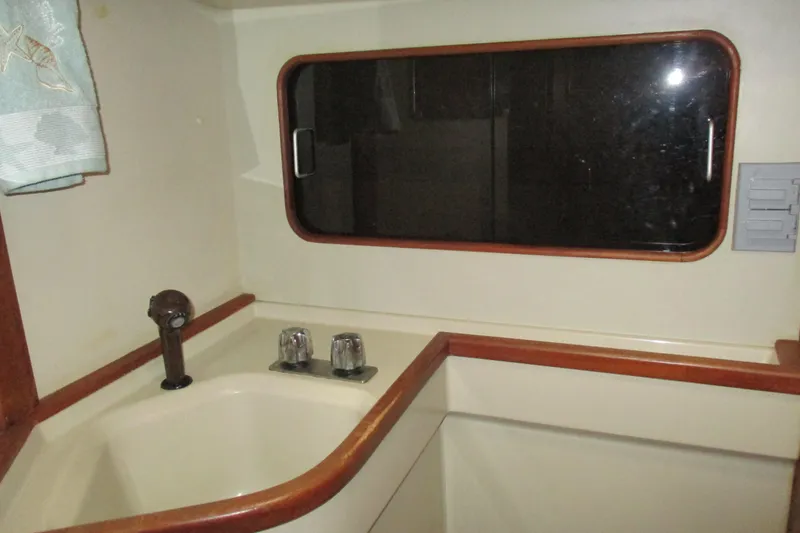 Slide: The Image of Interior of 1981 C & C 32 sailboat showing sink and window. - 37