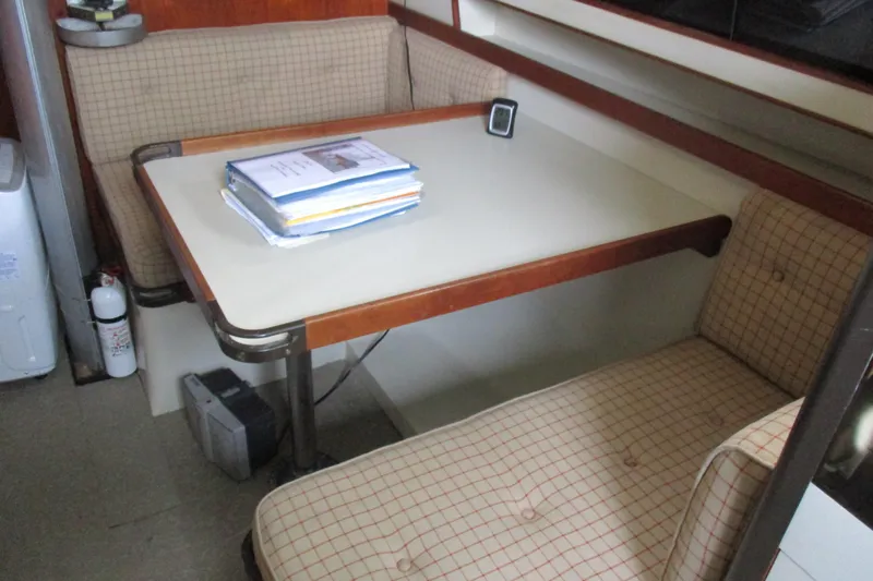 Slide: The Image of 1981 C & C 32 sailboat interior with dining table and cushioned seating. - 39