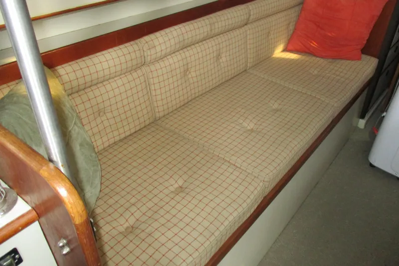Slide: The Image of Interior seating of 1981 C & C 32 sailboat with checkered cushions. - 40