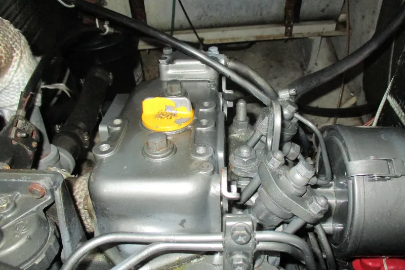 Slide: The Image of Engine compartment of a 1981 C & C 32 sailboat, featuring mechanical components. - 45