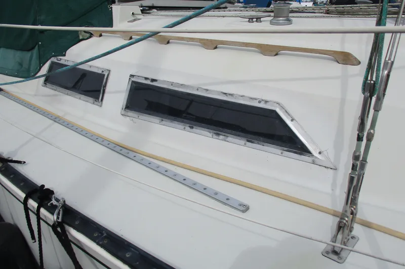 Slide: The Image of 1981 C & C 32 sailboat deck with windows and rigging details. - 7