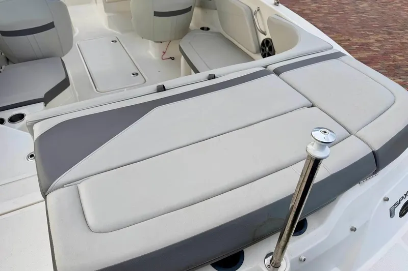 Slide: The Image of 2020 Sea Ray SPX 210 Outboard boat interior with cushioned seating and sleek design. - 13