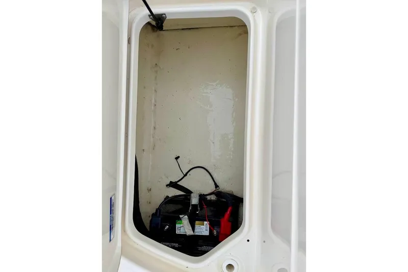 Slide: The Image of Battery compartment of 2020 Sea Ray SPX 210 Outboard boat, showing wiring and connections. - 16