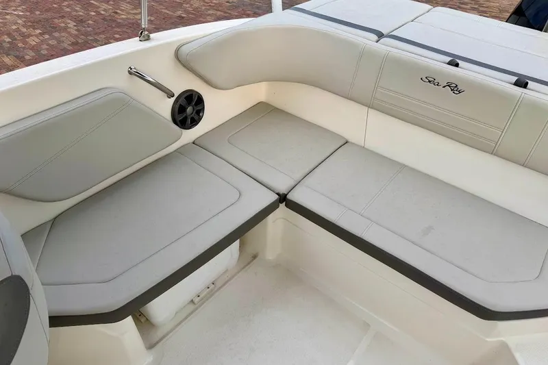 Slide: The Image of Interior seating of 2020 Sea Ray SPX 210 Outboard boat, featuring comfortable cushions. - 24