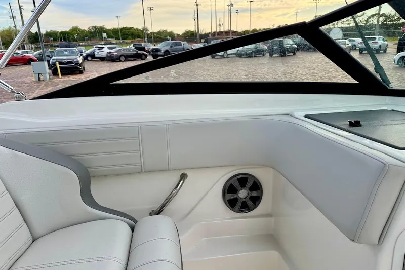 Slide: The Image of Interior of a 2020 Sea Ray SPX 210 Outboard boat with white seating and speaker. - 27