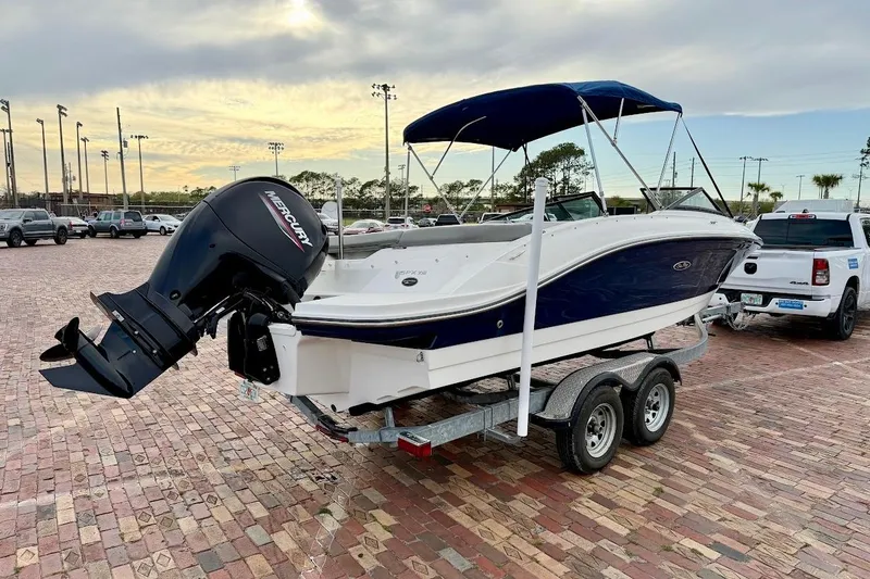 Slide: The Image of 2020 Sea Ray SPX 210 Outboard boat on trailer in parking lot. - 3